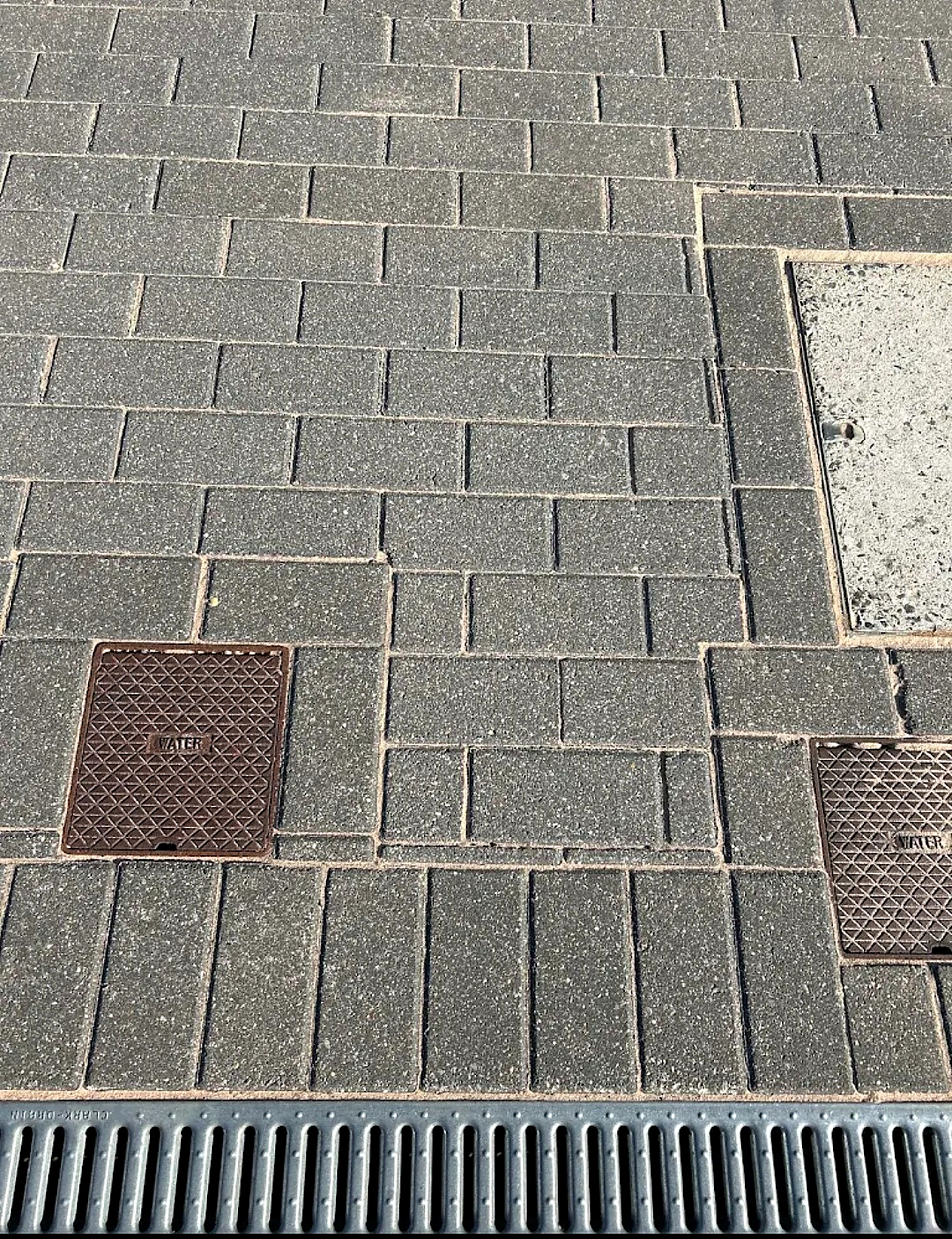 Close-up of grey block paving with clean joints